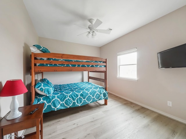 bedroom featuring light hardwood / wood-style flooring and ceiling fan