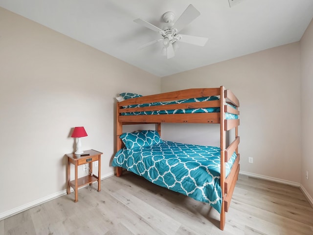 bedroom featuring ceiling fan and light wood-type flooring