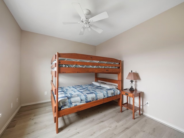 bedroom featuring ceiling fan and light hardwood / wood-style flooring