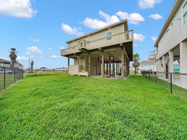 rear view of property with a yard and a patio