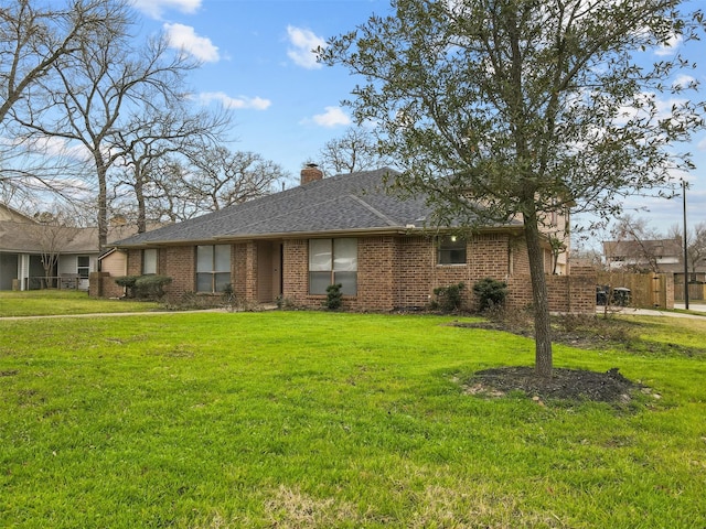 ranch-style home featuring a front yard