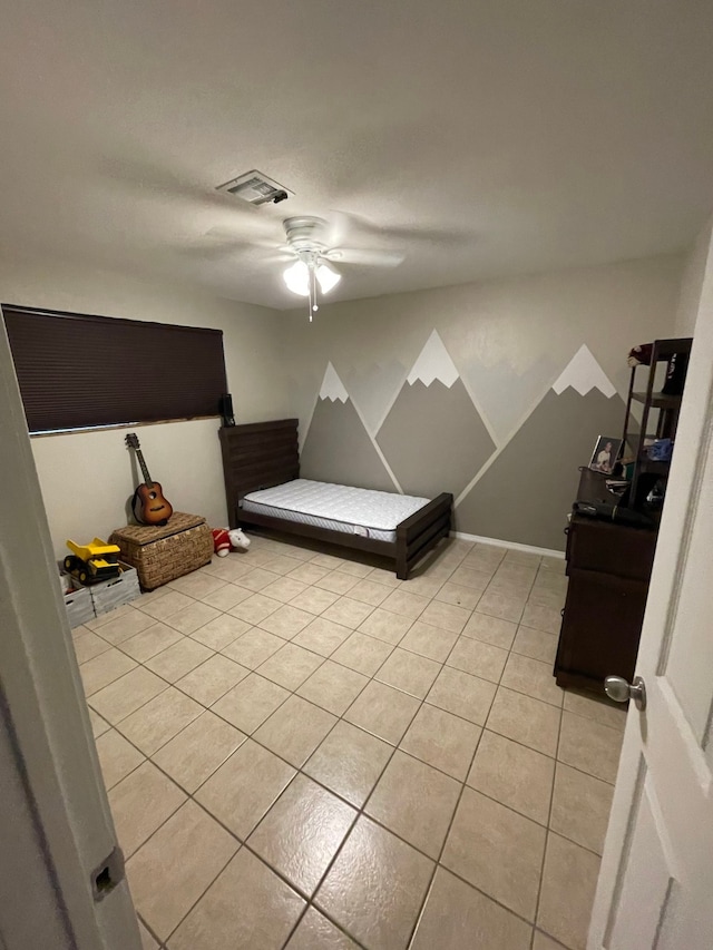 unfurnished bedroom with ceiling fan and light tile patterned floors