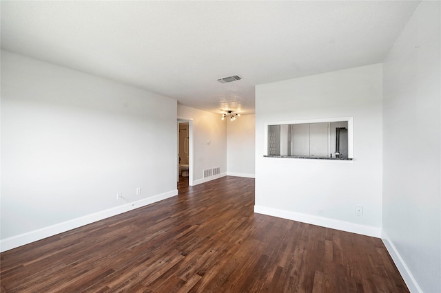 empty room featuring dark hardwood / wood-style floors