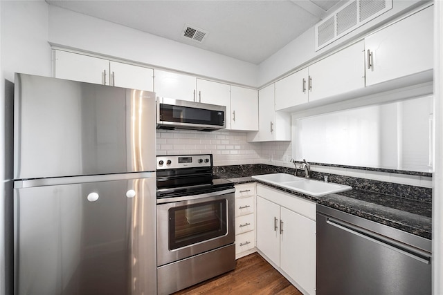 kitchen with white cabinetry, appliances with stainless steel finishes, and sink