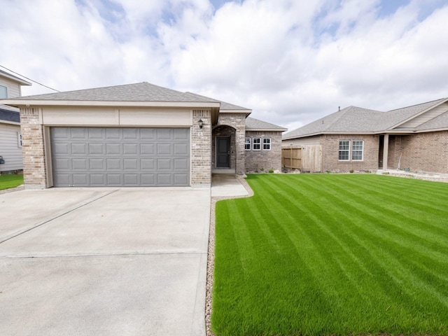 view of front of house featuring a garage and a front lawn