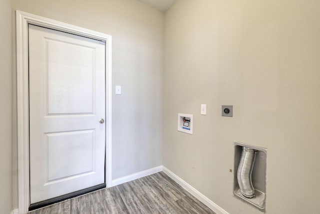 clothes washing area featuring hardwood / wood-style floors, washer hookup, and hookup for an electric dryer