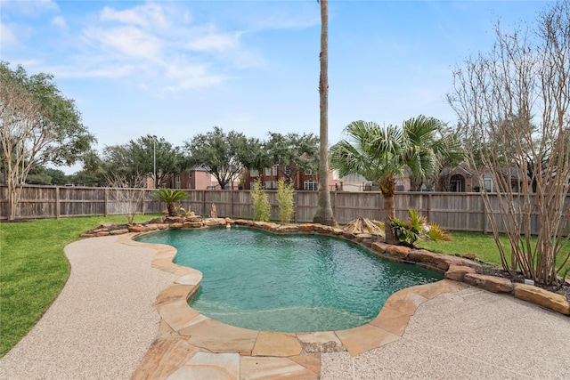 view of swimming pool with a yard and a patio