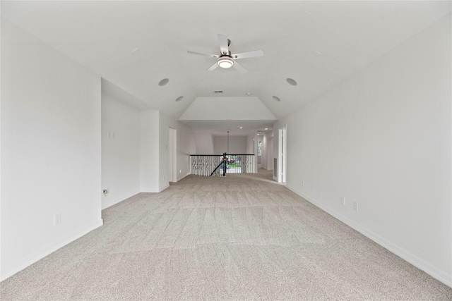 unfurnished living room with lofted ceiling, light colored carpet, and ceiling fan