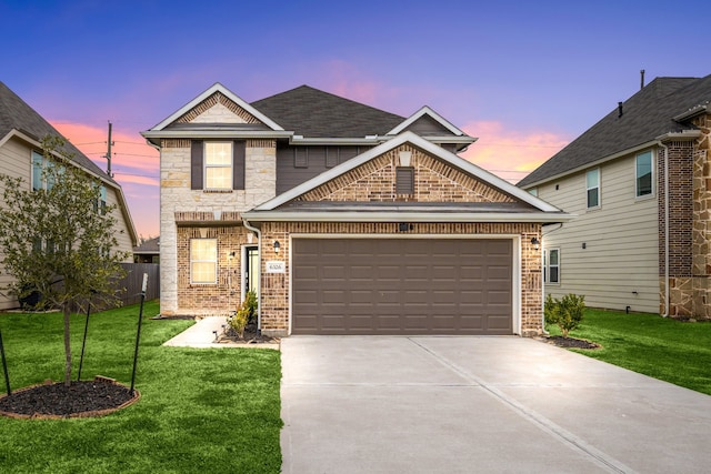 craftsman house with a garage and a yard