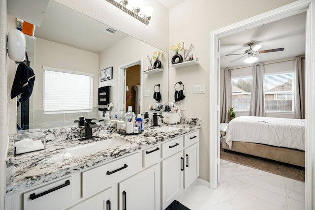 bathroom featuring vanity and ceiling fan