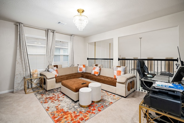 carpeted living room with a textured ceiling and a chandelier