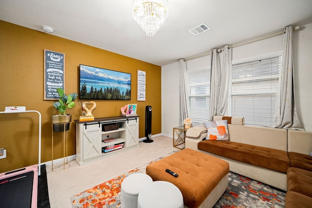 living room featuring carpet floors and a notable chandelier