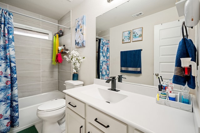 full bathroom with vanity, toilet, and shower / tub combo with curtain