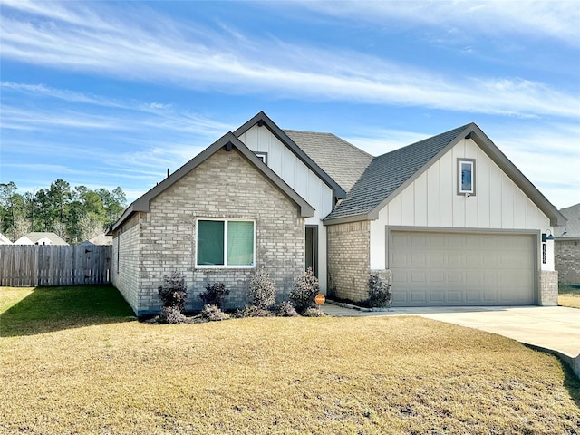 view of front of home featuring a garage and a front lawn