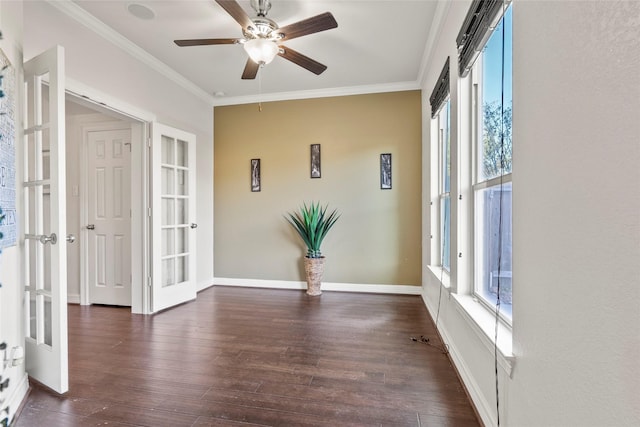 unfurnished room with crown molding, ceiling fan, dark hardwood / wood-style flooring, and french doors