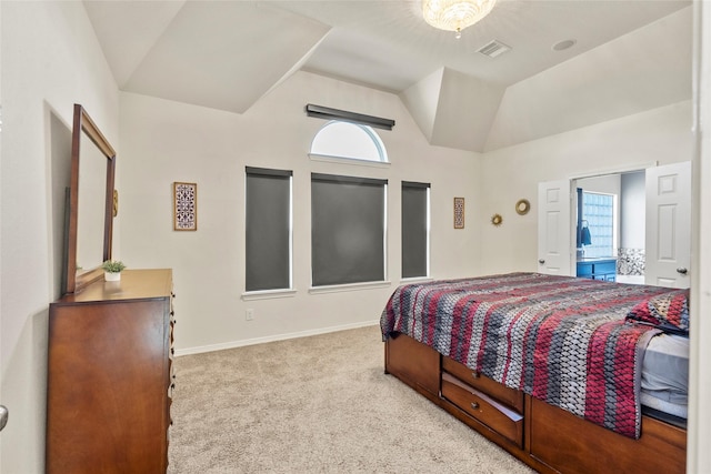 carpeted bedroom with lofted ceiling and multiple windows