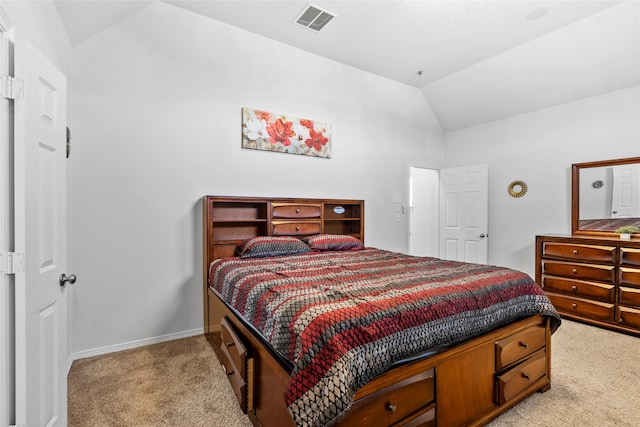 carpeted bedroom with vaulted ceiling