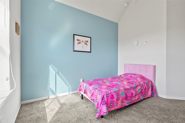 bedroom featuring lofted ceiling and carpet flooring