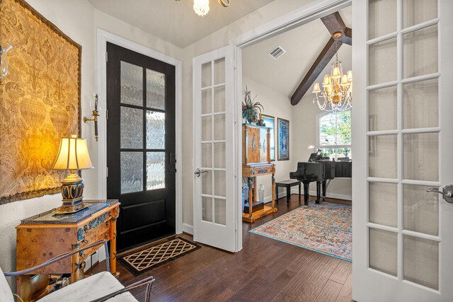 entrance foyer with french doors, vaulted ceiling with beams, visible vents, an inviting chandelier, and wood finished floors