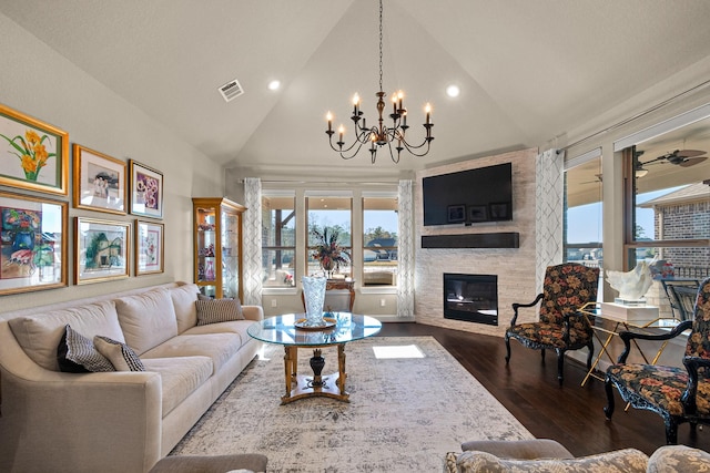 12169 Creekside Villas Ct, Conroe, TX 77304 - living room featuring a chandelier, dark wood-style flooring, a large fireplace, recessed lighting, and high vaulted ceiling