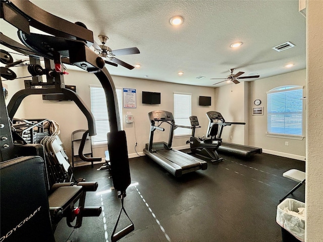 12169 Creekside Villas Ct, Conroe, TX 77304 - gym with a ceiling fan, baseboards, recessed lighting, and a textured ceiling