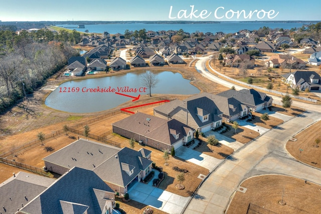 12169 Creekside Villas Ct, Conroe, TX 77304 - aerial view of residential area with a large body of water