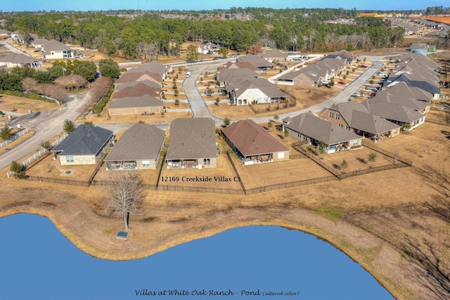 12169 Creekside Villas Ct, Conroe, TX 77304 - aerial view of property and surrounding area featuring nearby suburban area and a large body of water