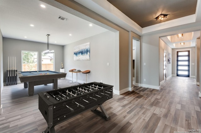 game room with wood finished floors, visible vents, and baseboards