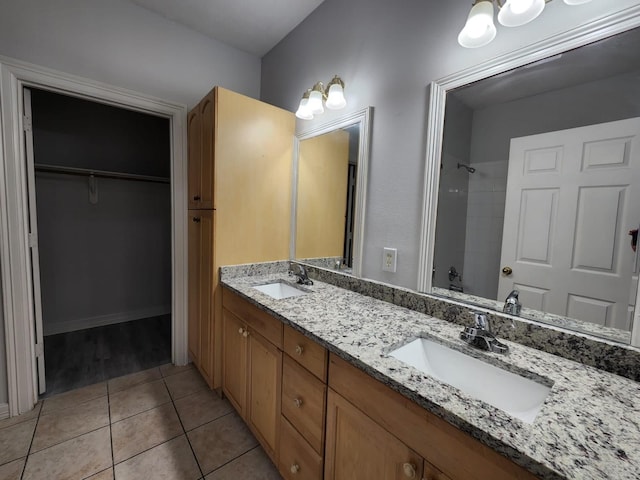 bathroom with tile patterned flooring, vanity, and bathing tub / shower combination