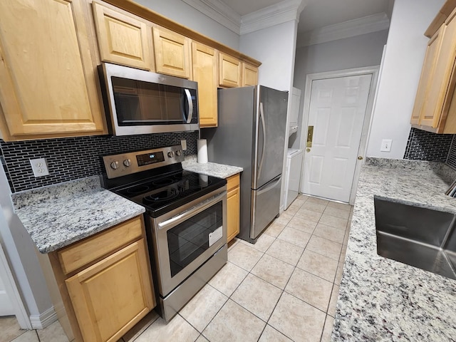 kitchen with sink, stainless steel appliances, tasteful backsplash, ornamental molding, and light stone countertops