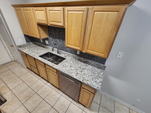 kitchen with sink, light tile patterned floors, black dishwasher, light stone countertops, and decorative backsplash