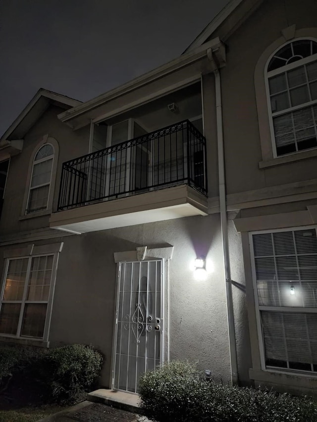 view of property exterior featuring a balcony