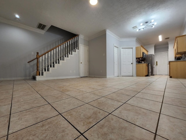 unfurnished living room with crown molding, a textured ceiling, and light tile patterned floors