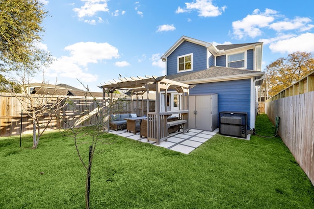 back of property with an outdoor living space, a yard, a fenced backyard, a pergola, and a patio