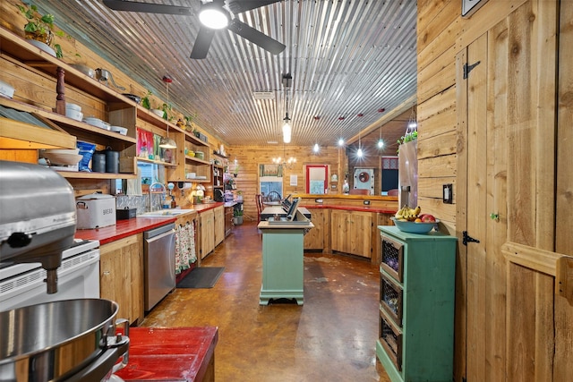 kitchen featuring wood walls, concrete floors, pendant lighting, and stainless steel dishwasher