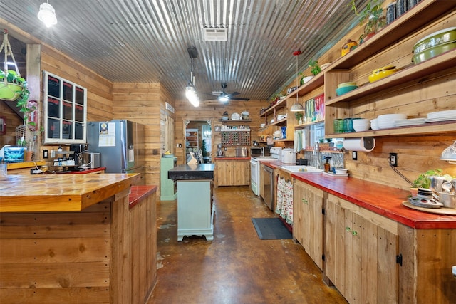 kitchen featuring wood counters, open shelves, stainless steel refrigerator with ice dispenser, and decorative light fixtures