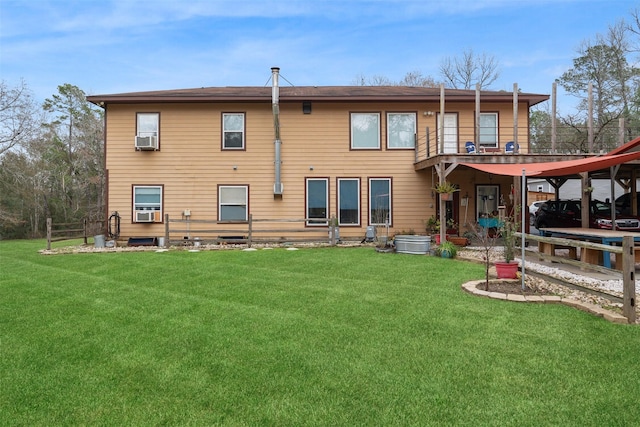 rear view of house featuring a lawn and cooling unit