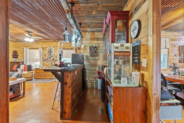 kitchen with wood walls, wooden ceiling, glass insert cabinets, and a ceiling fan