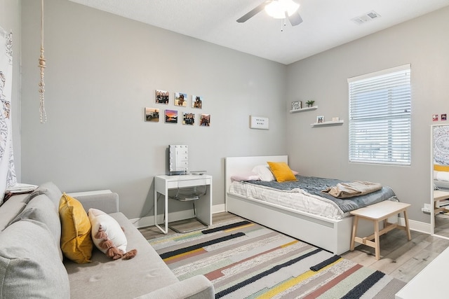 bedroom featuring wood-type flooring and ceiling fan