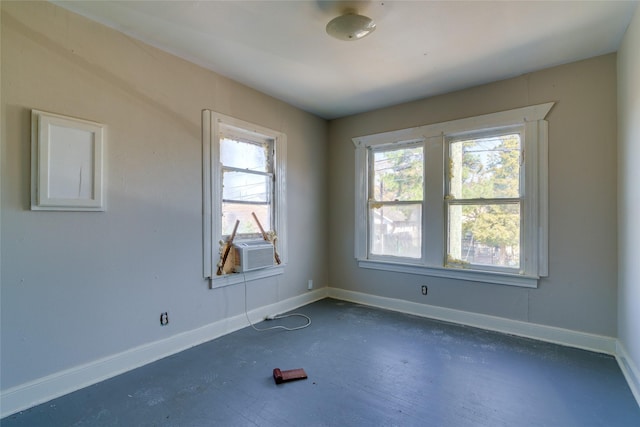 empty room with cooling unit and a healthy amount of sunlight