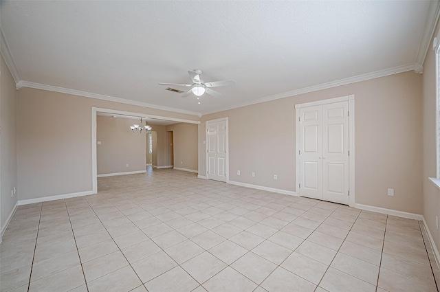 spare room featuring crown molding and ceiling fan with notable chandelier