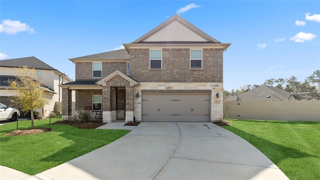 view of front of house with fence, driveway, an attached garage, a front lawn, and brick siding