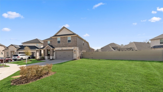 view of front of house with a garage, concrete driveway, a front lawn, and fence