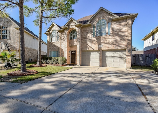 view of front of house with a garage and a front yard