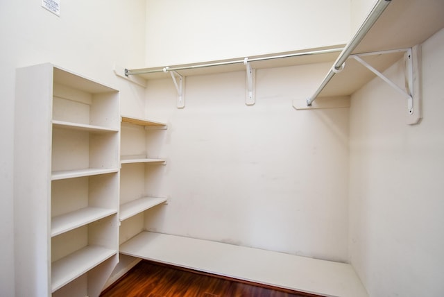 walk in closet featuring dark hardwood / wood-style flooring