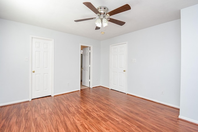 unfurnished room featuring ceiling fan and wood-type flooring