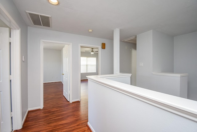 hallway featuring dark wood-type flooring