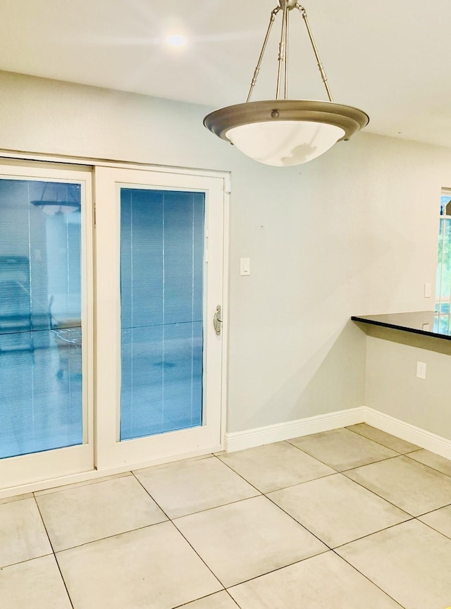 interior space with tile patterned floors