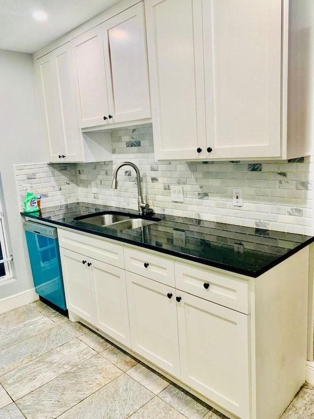 kitchen featuring white cabinetry, stainless steel dishwasher, and sink