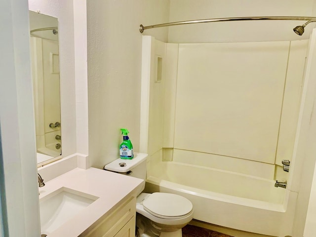 full bathroom with vanity, tub / shower combination, and toilet